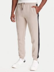 Guess Spodnie dresowe Z2YB09 KB3P2 Beżowy Regular Fit. Brązowe spodnie dresowe męskie Guess, z aplikacjami, z bawełny. Za 259.99 zł.
