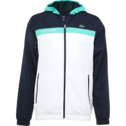 Lacoste Sport TENNIS JACKET Kurtka sportowa navy blue/white/papeete. Niebieskie kurtki treningowe męskie marki Lacoste Sport, z materiału. Za 629.00 zł.