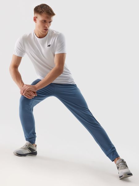 4F Spodnie treningowe szybkoschnące męskie - granatowe 3XL. Niebieskie długie spodnie sportowe męskie 4f, bez wzorów, z dzianiny. W wyprzedaży za 89.99 zł.