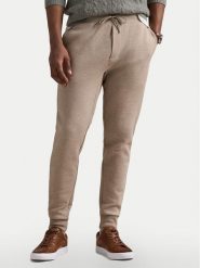Polo Ralph Lauren Spodnie dresowe 710881518046 Beżowy Regular Fit. Brązowe spodnie dresowe męskie Polo Ralph Lauren, bez wzorów, z dresówki. Za 569.99 zł.
