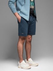 Krótkie spodenki dresowe męskie RELAXED FIT w stylu athleisure granatowe V4 OM-SRWS-0122 M. Szorty sportowe męskie Ombre, bez wzorów, z dresówki, sportowe. Za 121.01 zł.