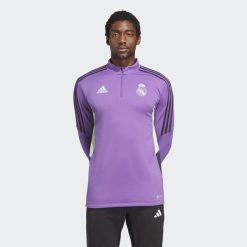 Bluza do piłki nożnej męska Adidas Real Madrid Condivo 22 Training Top. Fioletowe bluzy nierozpinane męskie ADIDAS, m, bez wzorów, z materiału, sportowe, bez ramiączek, bez kaptura. W wyprzedaży za 216.00 zł.