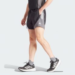 Szorty Own The Run Colorblock. Brązowe szorty sportowe męskie ADIDAS, bez wzorów, z materiału, sportowe. Za 166.45 zł.