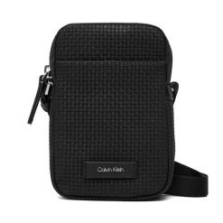 Saszetka Calvin Klein. Czarne saszetki męskie Calvin Klein, bez wzorów, młodzieżowe, małe. Za 329.99 zł.