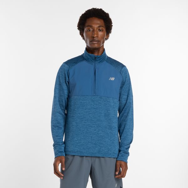 Bluza męska New Balance MT43204DAK – niebieska. Niebieskie bluzy nierozpinane męskie New Balance, m, bez wzorów, z materiału, bez ramiączek, bez kaptura. Za 249.99 zł.