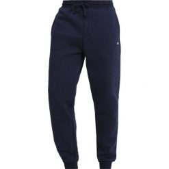 Tommy Jeans TOMMY CLASSICS Spodnie treningowe blue. Długie spodnie sportowe męskie Tommy Jeans. Za 349.00 zł.
