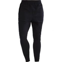 Under Armour Legginsy black/black. Długie spodnie sportowe męskie marki Under Armour. W wyprzedaży za 411.75 zł.