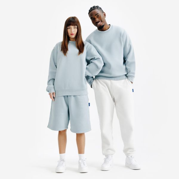 Bluza z okrągłym dekoltem unisex Elementals. Niebieskie bluzy nierozpinane męskie Decathlon, xs, bez wzorów, z bawełny, bez ramiączek, bez kaptura. Za 149.99 zł.