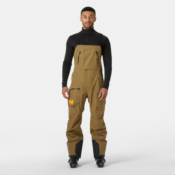 Kombinezon narciarski Helly Hansen Ridge Infinity. Brązowe spodnie narciarskie i snowboardowe męskie Helly Hansen, bez wzorów, narciarskie. W wyprzedaży za 2,201.50 zł.