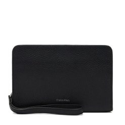 Saszetka Calvin Klein. Czarne saszetki męskie Calvin Klein, bez wzorów, młodzieżowe, małe. Za 289.99 zł.