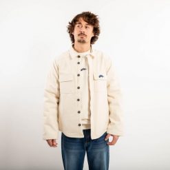 Ciepła kurtka skaterska z kolekcji Roos Zwetsloot, beżowa, niebarwiona. Białe kurtki męskie Decathlon, m, bez wzorów, z bawełny, sportowe, bez ramiączek, bez kaptura. Za 299.99 zł.