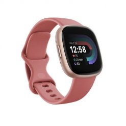 Versa 4 smart watch, pink body with pink silicone strap. Różowe smartbandy FITBIT. Za 902.99 zł.