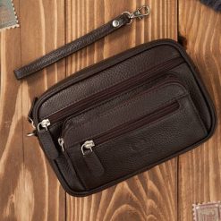 Skórzana saszetka męska do ręki skórzana brązowa pojemna Paolo Peruzzi T-130-BR. Brązowe saszetki męskie bez wzorów, ze skóry. Za 129.00 zł.