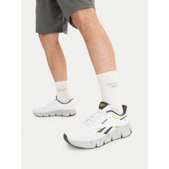 Buty do biegania Reebok. Białe buty do biegania męskie Reebok, bez wzorów, bez zapięcia, do biegania. Za 329.99 zł.