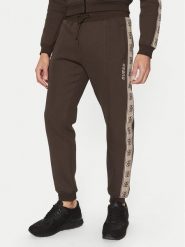 Guess Spodnie dresowe Z2YB09 KB3P2 Brązowy Regular Fit. Brązowe spodnie dresowe męskie Guess, z aplikacjami, z bawełny. Za 319.99 zł.