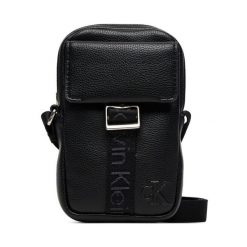 Saszetka Calvin Klein. Czarne saszetki męskie Calvin Klein, bez wzorów, młodzieżowe, małe. Za 189.99 zł.