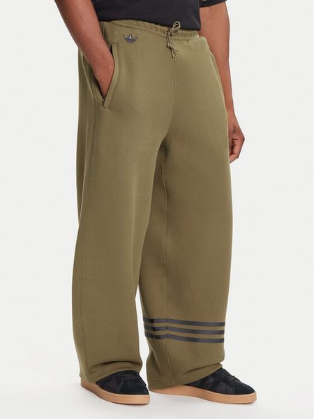 Adidas Spodnie dresowe Neuclassics JW5444 Zielony Loose Fit. Zielone spodnie dresowe męskie ADIDAS, bez wzorów, z dresówki. Za 199.99 zł.