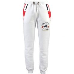 Spodnie dresowe "Moduk" w kolorze białym. Białe spodnie dresowe męskie marki Geographical Norway, z aplikacjami, z dresówki. W wyprzedaży za 117.95 zł.
