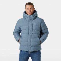 Ocieplana kurtka z kapturem Helly Hansen Alby. Niebieskie kurtki męskie Helly Hansen, bez wzorów, z puchu, sportowe, bez ramiączek, z kapturem. W wyprzedaży za 1,021.50 zł.