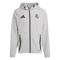 Kurtka przeciwdeszczowa z kapturem Real Madrid Competition Tiro 2024/25. Szare kurtki męskie ADIDAS, bez wzorów, sportowe, bez ramiączek, z kapturem. W wyprzedaży za 350.55 zł.