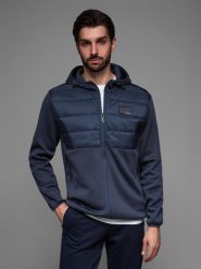 Lekka kurtka męska z łączonych materiałów z kapturem i ozdobnym pikowaniem – granatowa V4 OM-JANP-0160 - XXL. Niebieskie kurtki męskie Ombre Clothing, l, z aplikacjami, z gumy, bez ramiączek, z kapturem. W wyprzedaży za 139.99 zł.