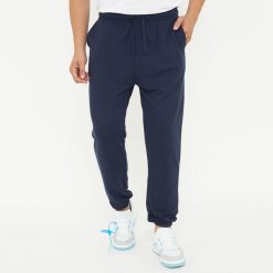 Spodnie sportowe unisex F BALLON niebieskie. Niebieskie długie spodnie sportowe męskie Legea, bez wzorów, z gumy, na fitness i siłownię. W wyprzedaży za 92.00 zł.