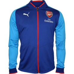 Kurtka sportowa "FC Arsenal" w kolorze niebieskim. Niebieskie kurtki treningowe męskie marki Puma, z materiału. W wyprzedaży za 159.95 zł.