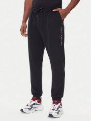Tommy Hilfiger Spodnie dresowe UM0UM03664 Czarny Regular Fit. Czarne spodnie dresowe męskie Tommy Hilfiger, bez wzorów, z bawełny. Za 269.99 zł.