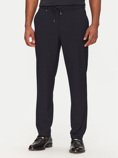 BOSS Spodnie materiałowe C-Perin 50540791 Granatowy Tapered Fit. Niebieskie spodnie na co dzień męskie Boss, bez wzorów, z materiału. Za 539.99 zł.