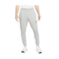 Spodnie sportowe męskie Nike Drifit Trapered. Szare szorty sportowe męskie Nike, bez wzorów, z dresówki, sportowe. Za 359.99 zł.