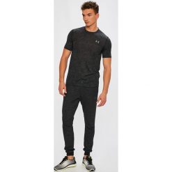Under Armour - Spodnie Baseline Tapered Pant. Szare spodnie dresowe męskie marki Under Armour, z bawełny. W wyprzedaży za 199.90 zł.