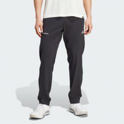 Spodnie Training Essentials Holiday Pack. Czarne długie spodnie sportowe męskie ADIDAS, bez wzorów. Za 259.00 zł.