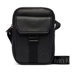 Saszetka Calvin Klein. Czarne saszetki męskie Calvin Klein, bez wzorów, małe. Za 329.99 zł.