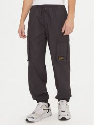 Champion Spodnie dresowe 220415 Czarny Loose Fit. Czarne spodnie dresowe męskie CHAMPION, bez wzorów, z bawełny. Za 239.99 zł.