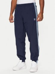 Adidas Spodnie dresowe adicolor Firebird JP1249 Granatowy Regular Fit. Niebieskie spodnie dresowe męskie ADIDAS, bez wzorów, z dresówki. Za 209.99 zł.