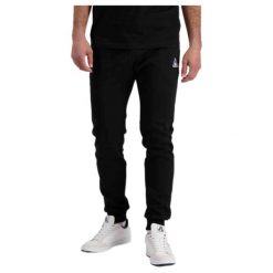 Wąskie spodnie do biegania Le Coq Sportif Pantalon de jogging ample Le Coq Sport. Czarne buty do biegania męskie le coq sportif, bez wzorów, bez zapięcia, do biegania. Za 318.95 zł.