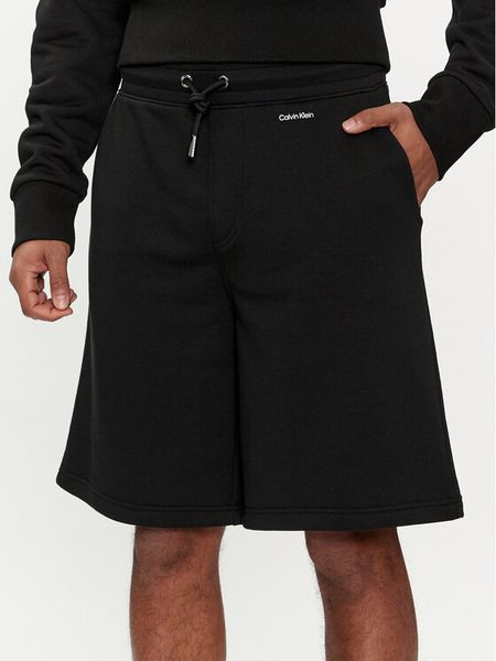 Calvin Klein Szorty sportowe Nano Logo K10K112689 Czarny Regular Fit. Czarne szorty sportowe męskie Calvin Klein, bez wzorów, z bawełny, sportowe. Za 209.99 zł.