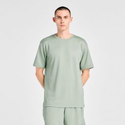 Koszulka męska New Balance MT6100FRAAR – zielona. Zielone t-shirty sportowe męskie New Balance, m, bez wzorów, z materiału, sportowe, bez ramiączek. Za 149.99 zł.