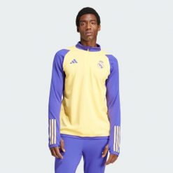 Bluza Real Madrid Tiro 23 Training. Żółte bluzy nierozpinane męskie ADIDAS, xl, bez wzorów, z materiału, eleganckie, bez ramiączek, bez kaptura. W wyprzedaży za 270.55 zł.