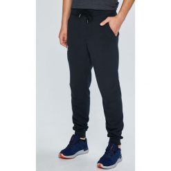 Under Armour - Spodnie Rival Cotton Jogger. Szare spodnie dresowe męskie marki Under Armour, z bawełny. W wyprzedaży za 219.90 zł.