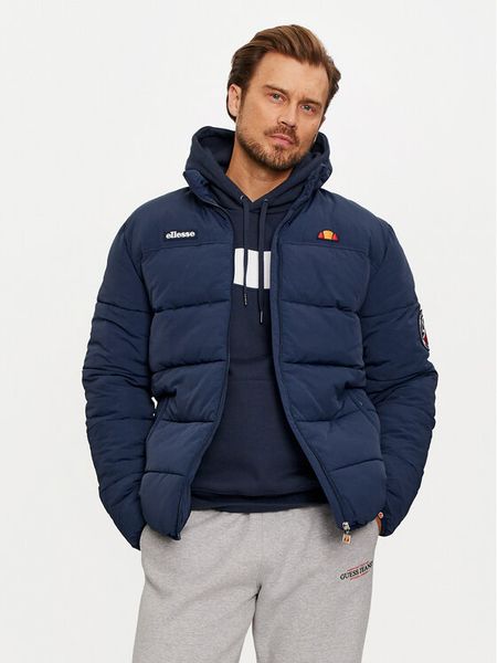 Ellesse Kurtka zimowa Nebula SHR12789 Granatowy Regular Fit. Niebieskie kurtki męskie Ellesse, na zimę, l, bez wzorów, z syntetyku, bez ramiączek, bez kaptura. Za 519.99 zł.