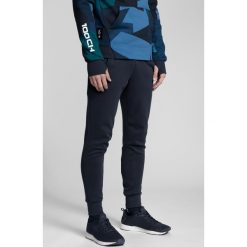 Spodnie dresowe męskie Kamil Stoch Collection SPMD501 - granat. Spodnie dresowe męskie marki 4f. W wyprzedaży za 129.99 zł.