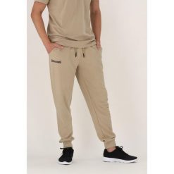Spodnie do biegania Spalding. Brązowe spodnie dresowe męskie Spalding, bez wzorów, z dresówki, sportowe. Za 338.50 zł.