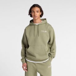 Bluza męska New Balance MT53528DEK – zielona. Zielone bluzy nierozpinane męskie New Balance, l, bez wzorów, z bawełny, klasyczne, bez ramiączek, z kapturem. Za 329.99 zł.
