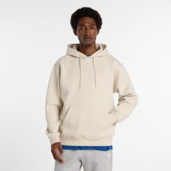 Bluza męska New Balance MT41511TWF – beżowa. Brązowe bluzy z kapturem męskie New Balance, l, z aplikacjami, z bawełny, z kapturem. Za 299.99 zł.