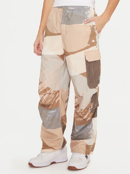 Champion Spodnie dresowe 220414 Beżowy Loose Fit. Brązowe spodnie dresowe męskie CHAMPION, bez wzorów, z bawełny. Za 219.99 zł.