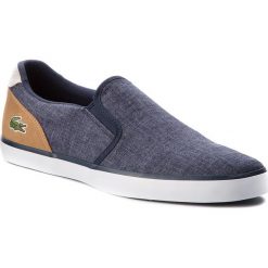 Tenisówki LACOSTE - Jouer Slip On 218 1 Cam 7-35CAM0050NT9 Nvy/Lt Tan. Niebieskie trampki męskie Lacoste, z gumy, klasyczne. W wyprzedaży za 259.00 zł.
