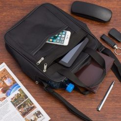 Męska torba na ramię raportówka A4 listonoszka czarna pojemna elegancka czarna F54. Czarne torby męskie na ramię bez wzorów, eleganckie, na ramię. Za 54.90 zł.