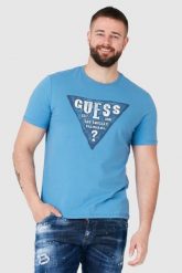 GUESS Niebieski t-shirt męski z dużym logo. Niebieskie t-shirty męskie Guess, m, z aplikacjami, bez kołnierzyka, bez ramiączek. W wyprzedaży za 109.99 zł.