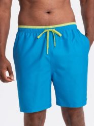 Spodenki męskie kąpielówki z dwukolorowym ściągaczem – niebieskie V6. Niebieskie kąpielówki męskie Ombre Clothing, l, bez wzorów, z poliesteru. W wyprzedaży za 59.99 zł.